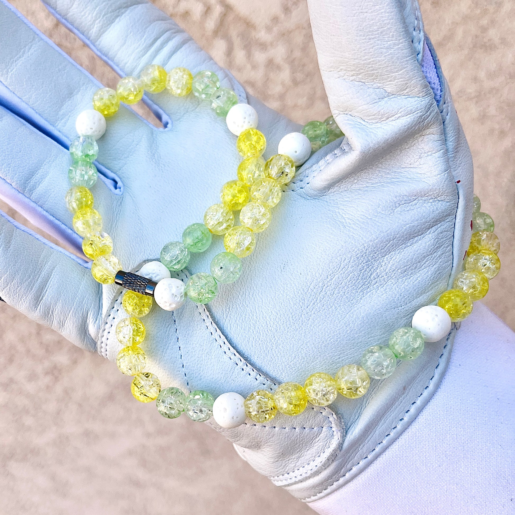 Glamour shot of Banana Necklace featuring real white lava rocks and yellow and lime ice beads.