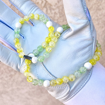 Glamour shot of Banana Necklace featuring real white lava rocks and yellow and lime ice beads.