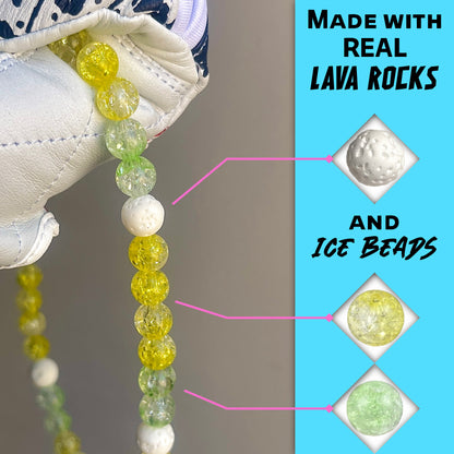 Close-up of white lava rocks and yellow and lime ice beads on the hand crafted baseball accessory.