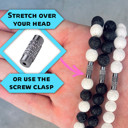 Details of the barrel clasp showing easy wear design on the elastic necklace.