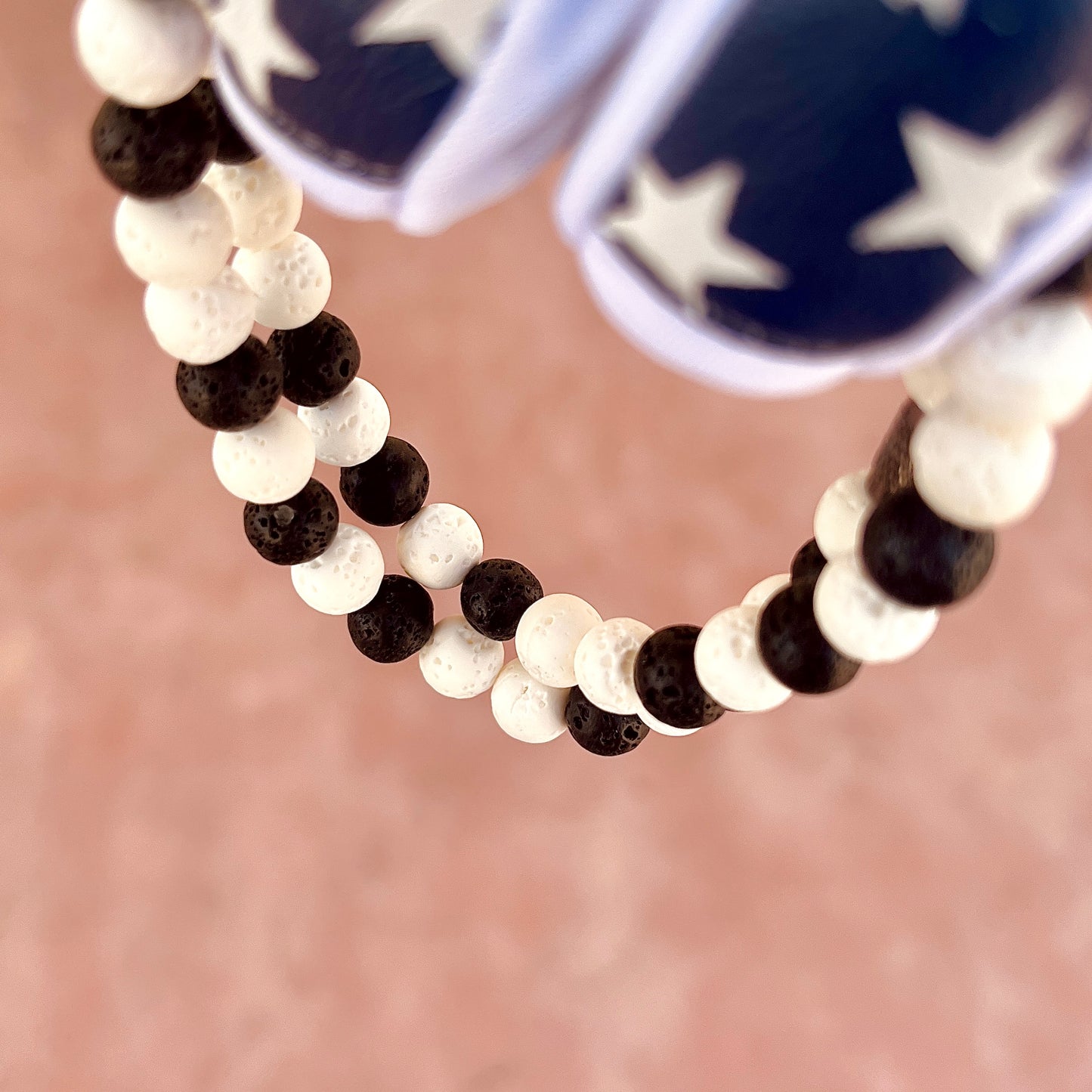 Glamour shot of Cookies n Cream Necklace featuring real white and black lava rocks.