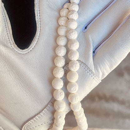 Glamour shot of Moonshot Necklace featuring real white lava rocks.