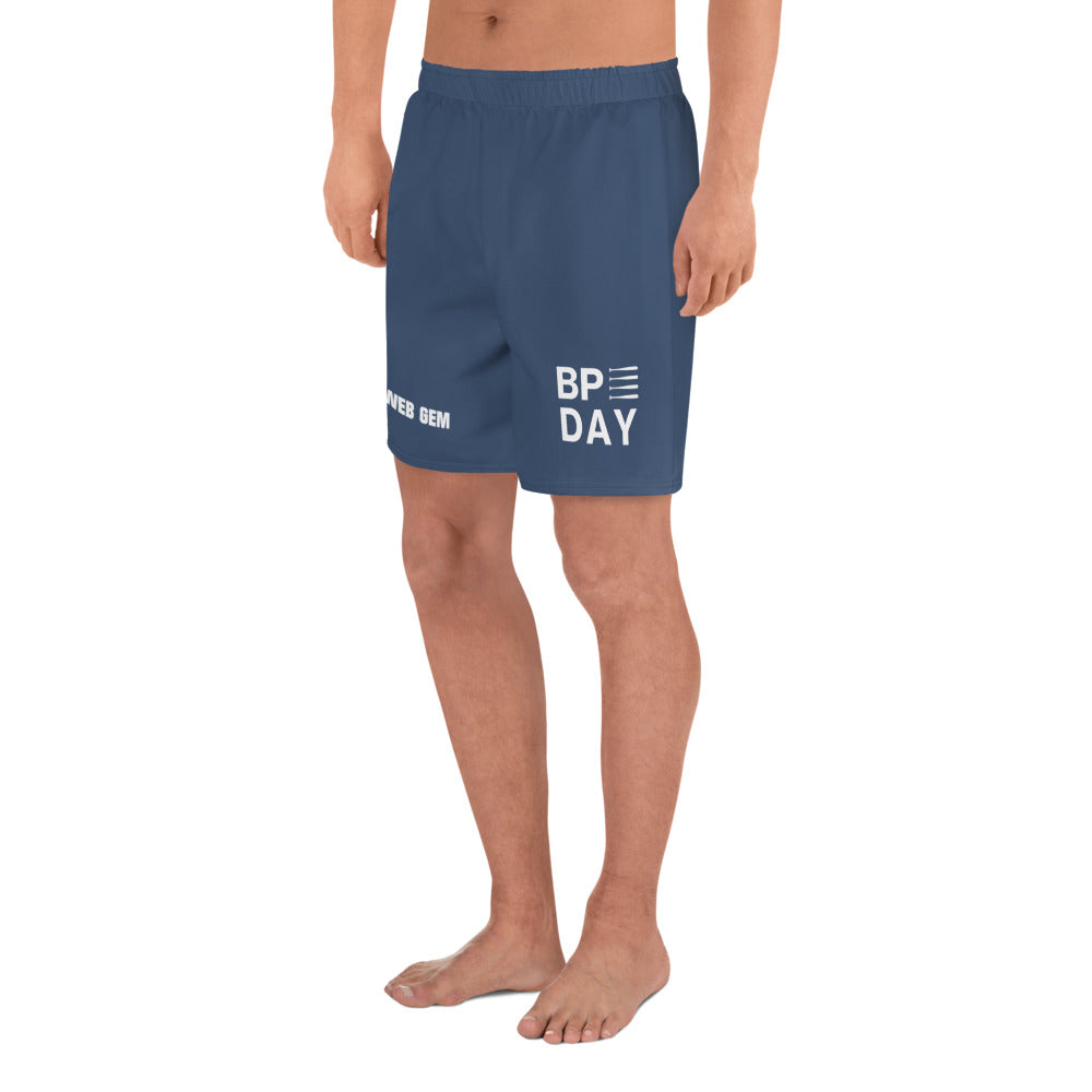 The left side of the navy shorts showing the BP Day graphic, available in adult 2XS through 2XL.