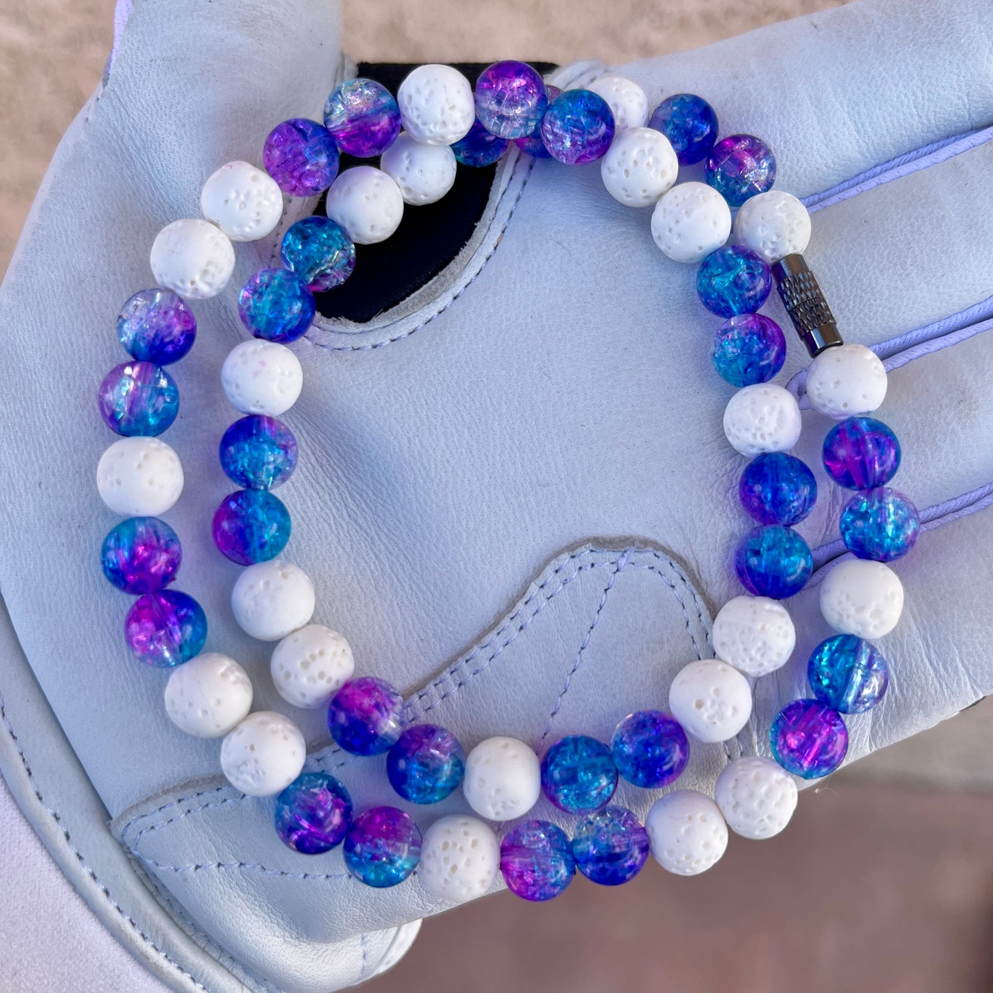 Glamour shot of Polar Vortex Necklace featuring real white lava rocks and galaxy ice beads.