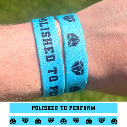 Polished to Perform double-sided elastic wristband designs shown on a baseball player.