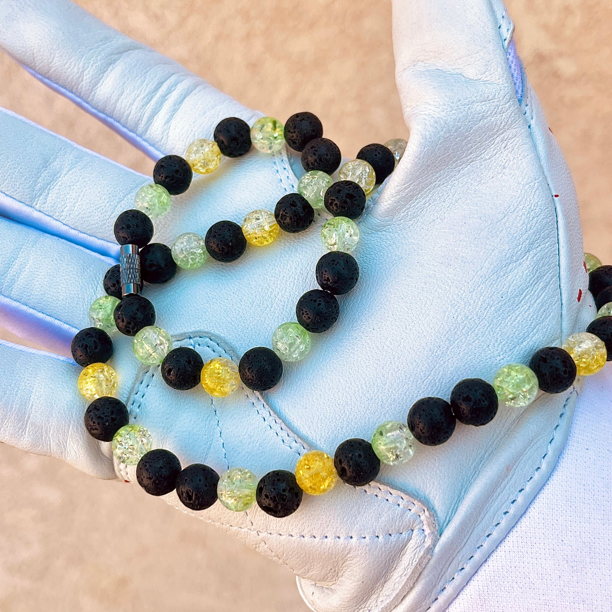 Glamour shot of Radioactive Necklace featuring real black lava rocks and yellow and lime ice beads.