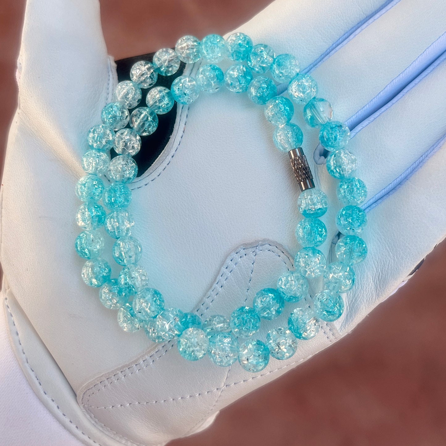 Glamour shot of Rizzberry Necklace featuring baby blue ice beads.