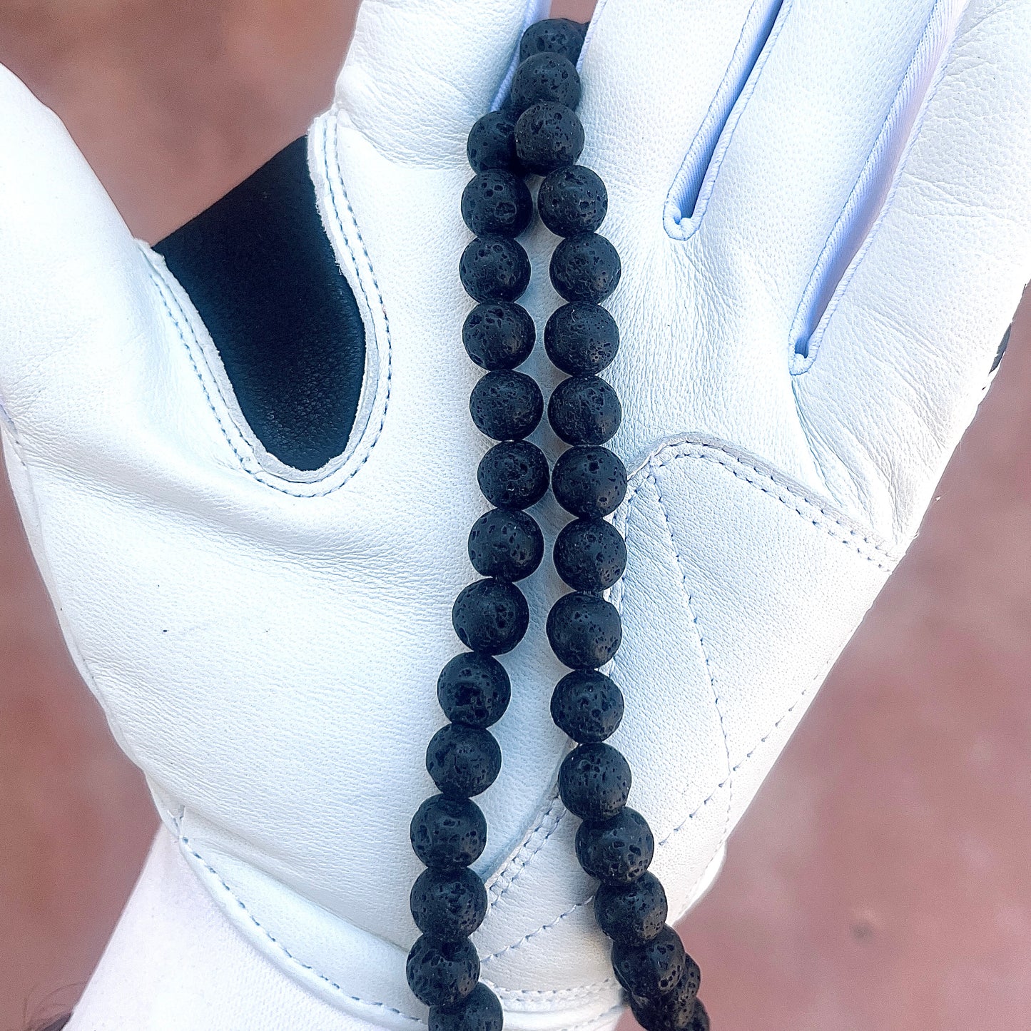 Glamour shot of Shadow Necklace featuring real black lava rocks.