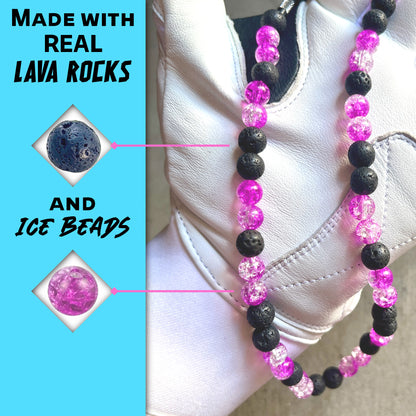 Close-up of black lava rocks and berry ice beads on the hand crafted baseball accessory.